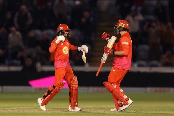 Qais Ahmad and Josh Cobb of Welsh Fire celebrate winning during The Hundred match between Welsh Fire Men and London Spirit Men at Sophia Gardens on...
