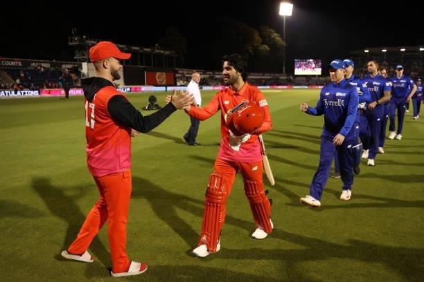 Ben Duckett and Qais Ahmad of Welsh Fire celebrate victory during The Hundred match between Welsh Fire Men and London Spirit Men at Sophia Gardens on...