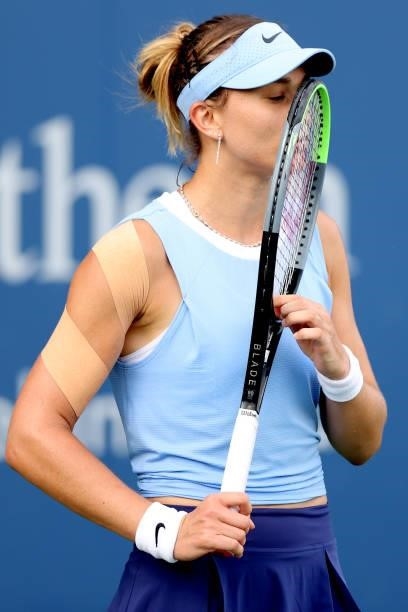 Paula Badosa of Spain kisses her racquet while playing Aryna Sabalenka of Belarus during the Western & Southern Open at Lindner Family Tennis Center...