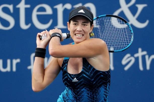 Garbine Muguruza of Spain plays a backhand during her match against Cori Gauff during Western & Southern Open - Day 4 at Lindner Family Tennis Center...