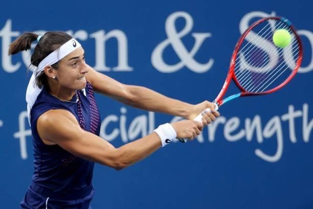 Caroline Garcia of France plays a backhand during her match against Garbine Muguruza of Spain during Western & Southern Open - Day 4 at Lindner...