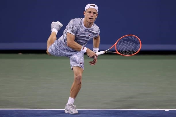 Diego Schwartzman of Argentina serves to Frances Tiafoe during the Western & Southern Open at Lindner Family Tennis Center on August 18, 2021 in...