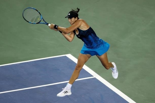 Garbine Muguruza of Spain plays a backhand during her match against Caroline Garcia of France during Western & Southern Open - Day 4 at Lindner...