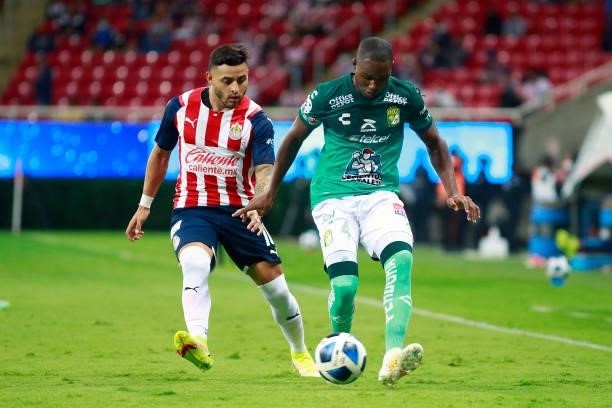 Ernesto Alexis Vega of Chivas fights for the ball with Andres Mosquera of Leon during the 5th round match between Chivas and Leon as part of the...
