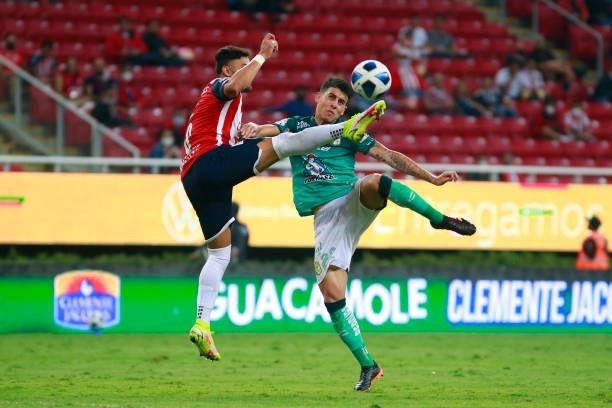 Ernesto Alexis Vega of Chivas fights for the ball with Santiago Colombatto of Leon during the 5th round match between Chivas and Leon as part of the...