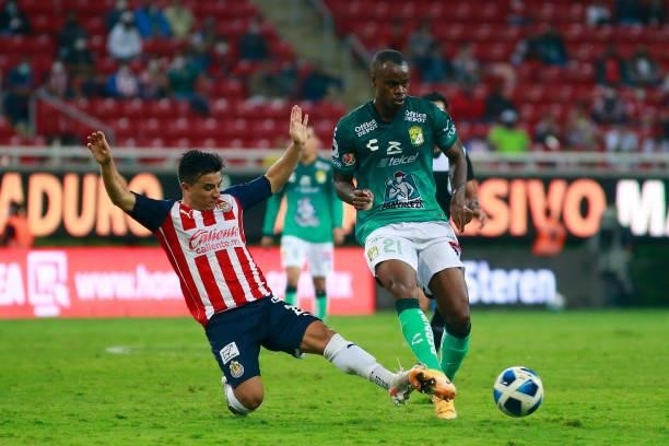 Fernando Beltran of Chivas fights for the ball with Jaine Barreiro of Leon during the 5th round match between Chivas and Leon as part of the Torneo...