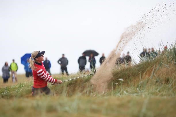 Charley Hull of England plays a bunker shot for her third shot on the first hole during Day One of the AIG Women's Open at Carnoustie Golf Links on...