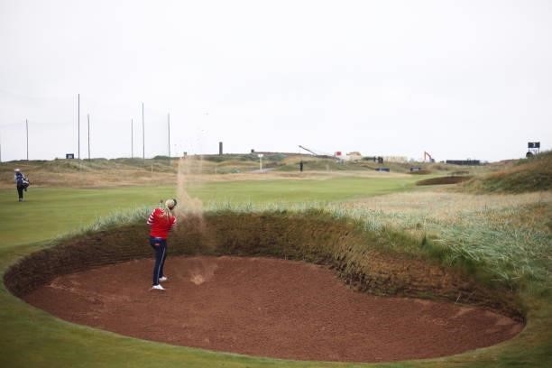 Charley Hull of England plays a bunker shot on the second hole during Day One of the AIG Women's Open at Carnoustie Golf Links on August 19, 2021 in...