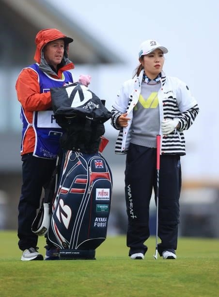 Ayaka Furue of Japan and her caddie look on during Day One of the AIG Women's Open at Carnoustie Golf Links on August 19, 2021 in Carnoustie,...