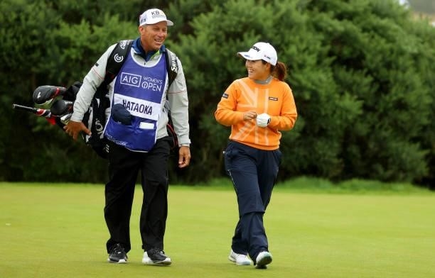 Nasa Hataoka of Japan and her caddie during the first round of the AIG Women's Open at Carnoustie Golf Links on August 19, 2021 in Carnoustie,...