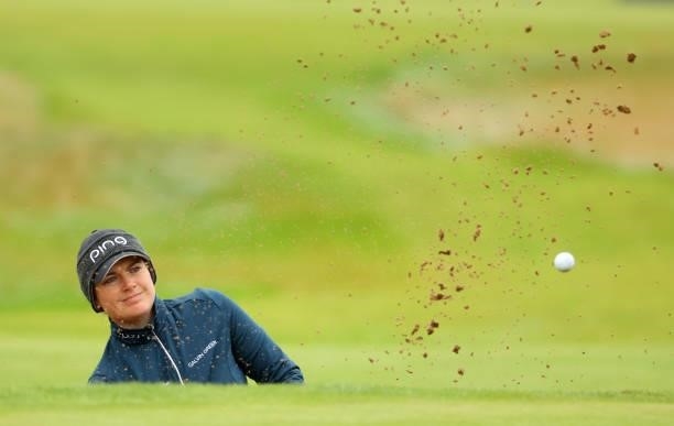 Caroline Masson of Germany plays from a green side bunker on the 8th green during the first round of the AIG Women's Open at Carnoustie Golf Links on...