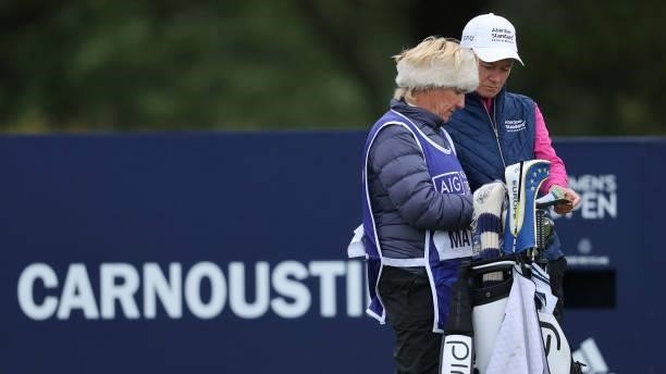 Catriona Matthew of Scotland prepares to tee off on the eighth hole with her caddie during Day One of the AIG Women's Open at Carnoustie Golf Links...