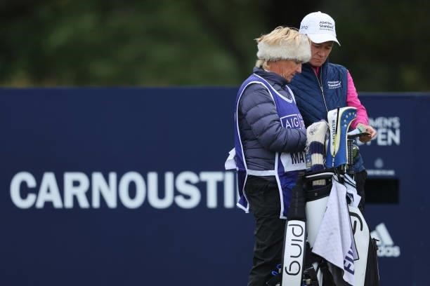 Catriona Matthew of Scotland prepares to tee off on the eighth hole with her caddie during Day One of the AIG Women's Open at Carnoustie Golf Links...