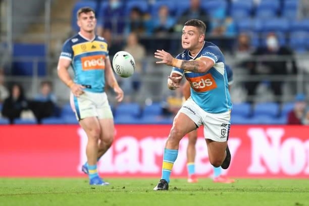 Ashley Taylor of the Titans passes the ball during the round 23 NRL match between the Gold Coast Titans and the Melbourne Storm at Cbus Super...