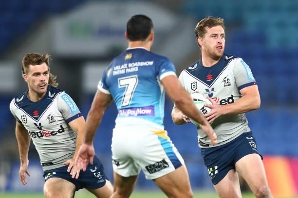 Cameron Munster of the Storm looks to pass the ball during the round 23 NRL match between the Gold Coast Titans and the Melbourne Storm at Cbus Super...