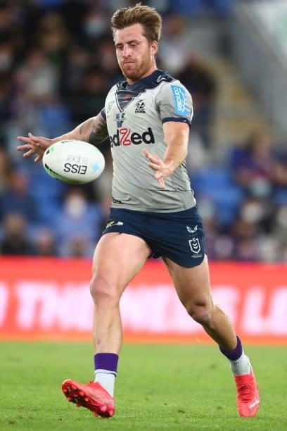Cameron Munster of the Storm kicks the ball during the round 23 NRL match between the Gold Coast Titans and the Melbourne Storm at Cbus Super...