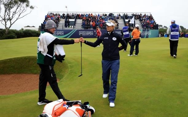 Nelly Korda of The United States fist bumps her caddie on the 13th green during the first round of the AIG Women's Open at Carnoustie Golf Links on...