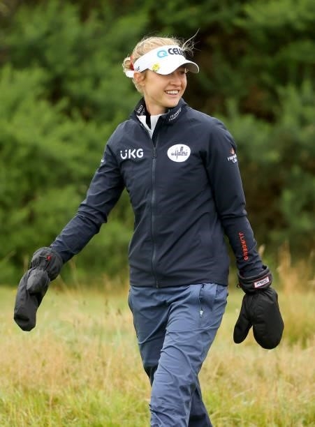 Nelly Korda of The United States keeping warm on the 14th hole during the first round of the AIG Women's Open at Carnoustie Golf Links on August 19,...