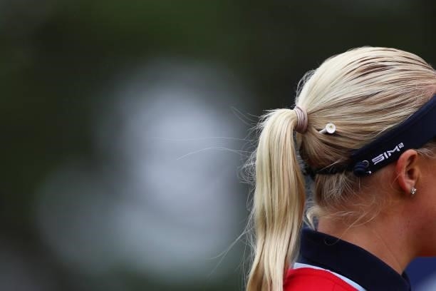 Detail view of a tee held in Charley Hull of England's hair during Day One of the AIG Women's Open at Carnoustie Golf Links on August 19, 2021 in...