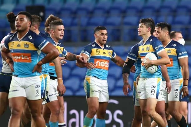 Jayden Campbell of the Titans celebrates scoring a try with team mates during the round 23 NRL match between the Gold Coast Titans and the Melbourne...