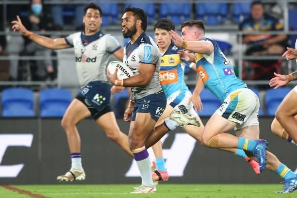 George Jennings of the Storm makes a break during the round 23 NRL match between the Gold Coast Titans and the Melbourne Storm at Cbus Super Stadium,...