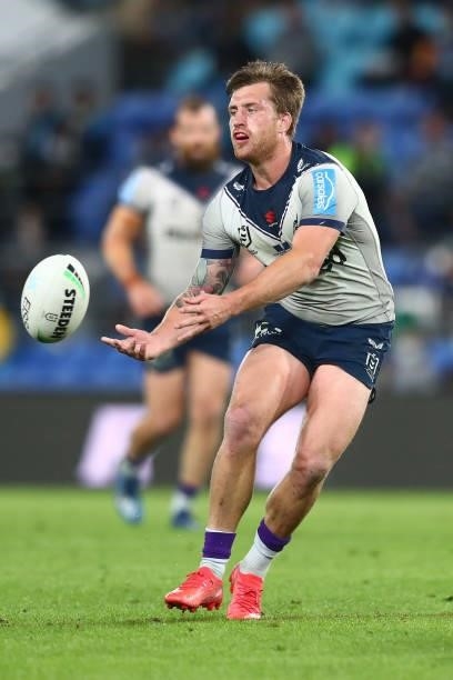 Cameron Munster of the Storm passes the ball during the round 23 NRL match between the Gold Coast Titans and the Melbourne Storm at Cbus Super...