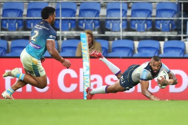 Josh Addo-Carr of the Storm scores a try during the round 23 NRL match between the Gold Coast Titans and the Melbourne Storm at Cbus Super Stadium,...