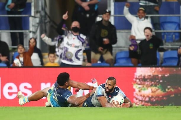 Josh Addo-Carr of the Storm scores a try during the round 23 NRL match between the Gold Coast Titans and the Melbourne Storm at Cbus Super Stadium,...