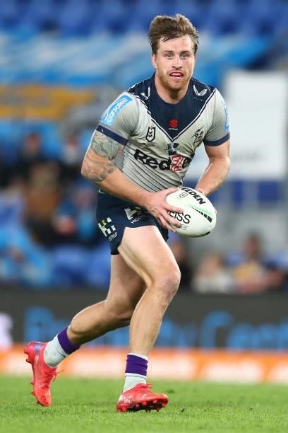 Cameron Munster of the Storm runs with the ball during the round 23 NRL match between the Gold Coast Titans and the Melbourne Storm at Cbus Super...