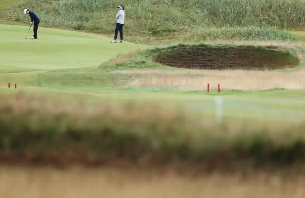 Competitors putt out on the fifth green during Day One of the AIG Women's Open at Carnoustie Golf Links on August 19, 2021 in Carnoustie, Scotland.