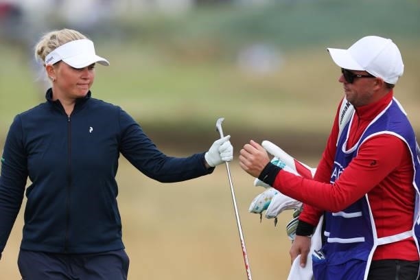 Nanna Koerstz Madsen of Denmark and her caddie fist bump on the fourth hole during Day One of the AIG Women's Open at Carnoustie Golf Links on August...