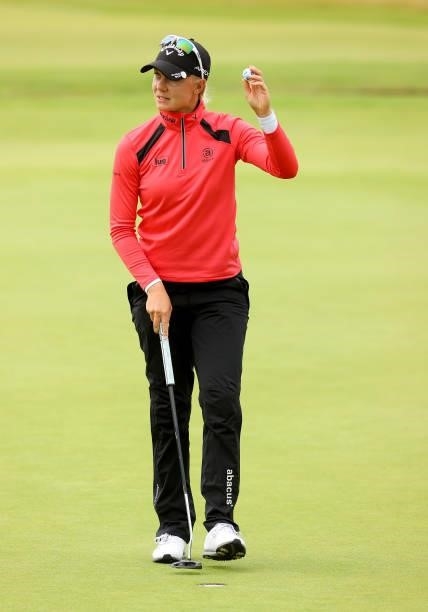 Madelene Sagstrom of Sweden reacts after her putt on the 18th green during the first round of the AIG Women's Open at Carnoustie Golf Links on August...