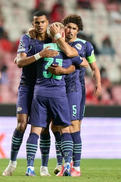 Cody Gakpo of PSV Eindhoven celebrates with his team mates after scoring their side's first goal during the UEFA Champions League Play-Offs Leg One...