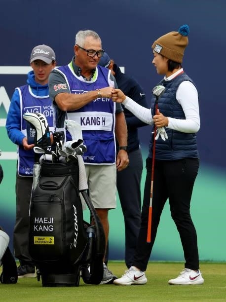 Haeji Kang of Korea and her caddie on the first hole during the first round of the AIG Women's Open at Carnoustie Golf Links on August 19, 2021 in...