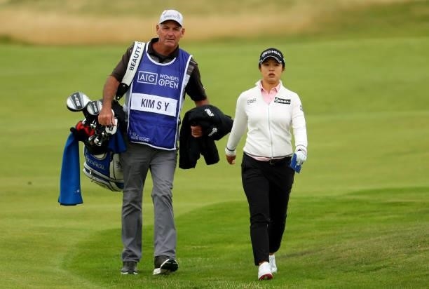 Sei Young Kim of South Korea and her caddie walking down the 15th fairway during the first round of the AIG Women's Open at Carnoustie Golf Links on...
