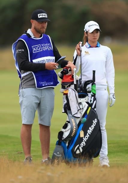 Pannarat Thanapolboonyaras of Thailand and her caddie look on from the fourth hole during Day One of the AIG Women's Open at Carnoustie Golf Links on...