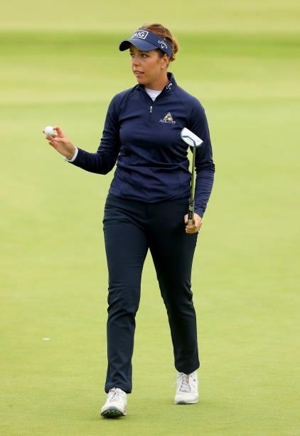 Georgia Hall of England acknowledges the crowds after finishing on the 18th hole during the first round of the AIG Women's Open at Carnoustie Golf...