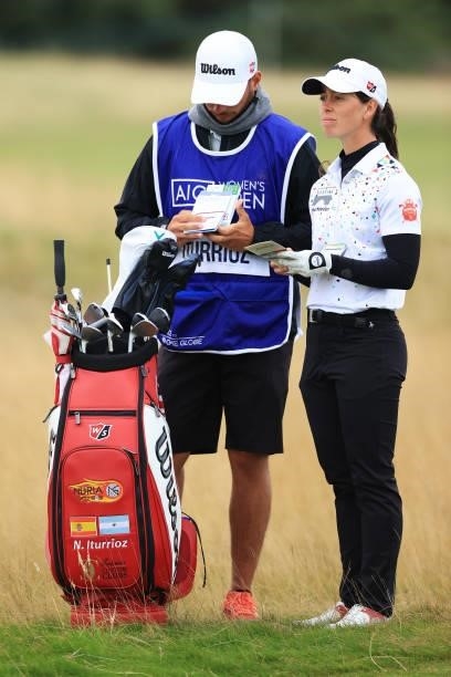 Nuria Iturrioz of Spain prepares to play her second shot on the fourth hole with her caddie during Day One of the AIG Women's Open at Carnoustie Golf...