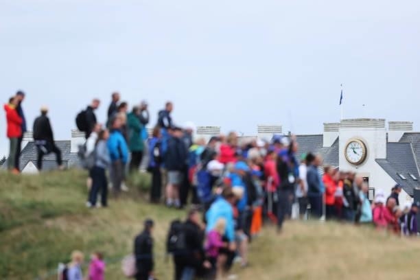 Rolex clock on the Carnoustie Golf Hotel and Spa is pictured as crowds look on from the fifteenth green during Day One of the AIG Women's Open at...