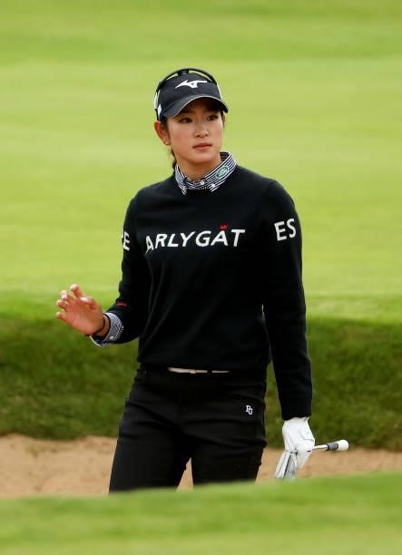 Erika Hara of Japan on acknowledges the crowd after her third shot on the 18th hole during the first round of the AIG Women's Open at Carnoustie Golf...