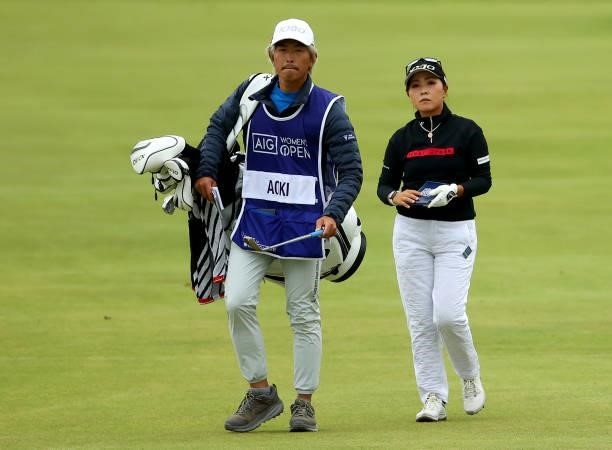 Serena Aoki of Japan and her caddie on the 18th hole during the first round of the AIG Women's Open at Carnoustie Golf Links on August 19, 2021 in...
