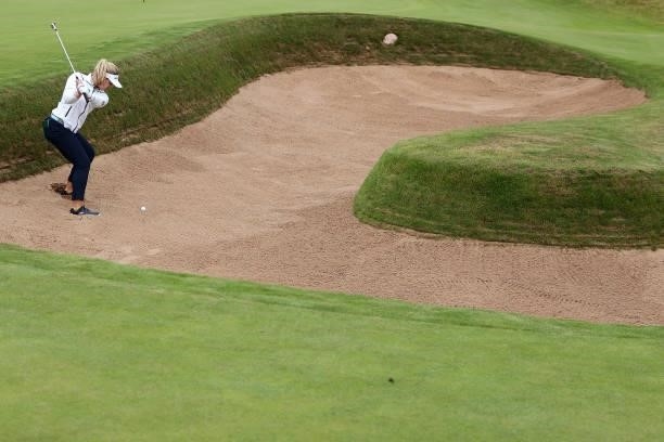 Brooke Henderson of Canada plays a shot out of the greenside bunker on the eighteenth hole during Day One of the AIG Women's Open at Carnoustie Golf...