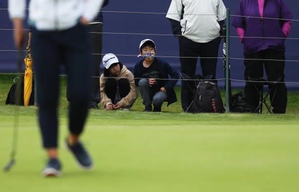 Young fans look on across the eighteenth green during Day One of the AIG Women's Open at Carnoustie Golf Links on August 19, 2021 in Carnoustie,...