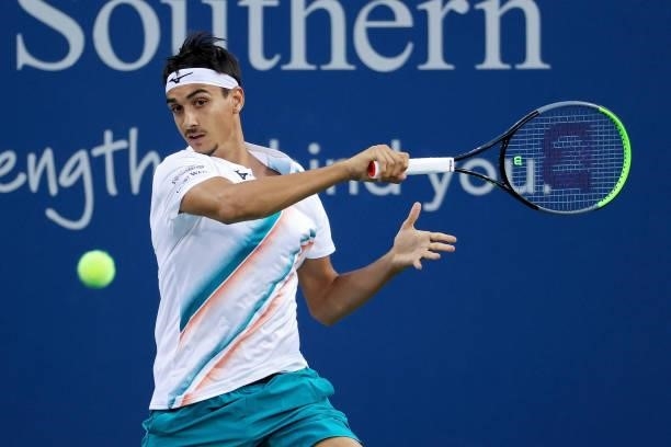 Lorenzo Sonego of Italy plays a forehand during his match against Stefanos Tsitsipas of Greece during Western & Southern Open - Day 5 at the Lindner...