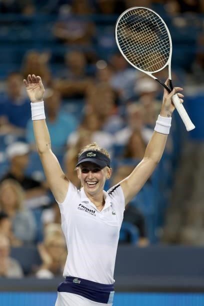 Jill Teichmann of Switzerland celebrates her win against Naomi Osaka of Japan during the Western & Southern Open at Lindner Family Tennis Center on...