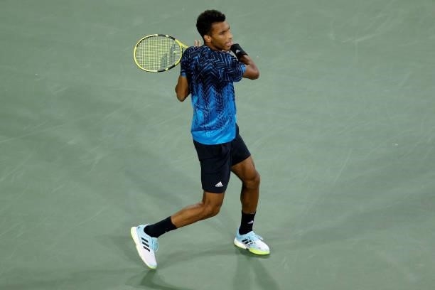 Felix Auger-Aliassime of Canada plays a forehand during his match against Matteo Berrettini of Italy during Western & Southern Open - Day 5 at the...