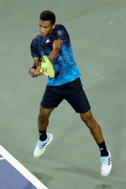 Felix Auger-Aliassime of Canada plays a backhand during his match against Matteo Berrettini of Italy during Western & Southern Open - Day 5 at the...