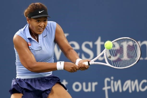 Naomi Osaka of Japan returns a shot to Jill Teichmann of Switzerland during the Western & Southern Open at Lindner Family Tennis Center on August 19,...