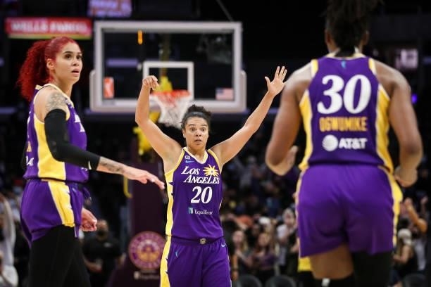 Amanda Zahui B, Kristi Toliver, and Nneka Ogwumike of the Los Angeles Sparks react to a game-winning shot by Ogwumike counted after review in the...