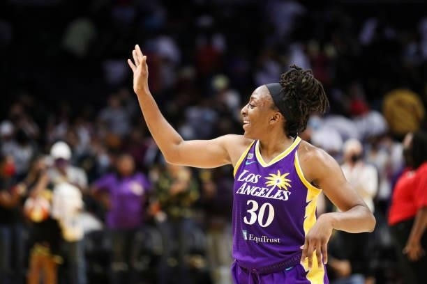 Nneka Ogwumike of the Los Angeles Sparks waves to fans after a game-winning buzzer beater against the Atlanta Dream at Staples Center on August 19,...